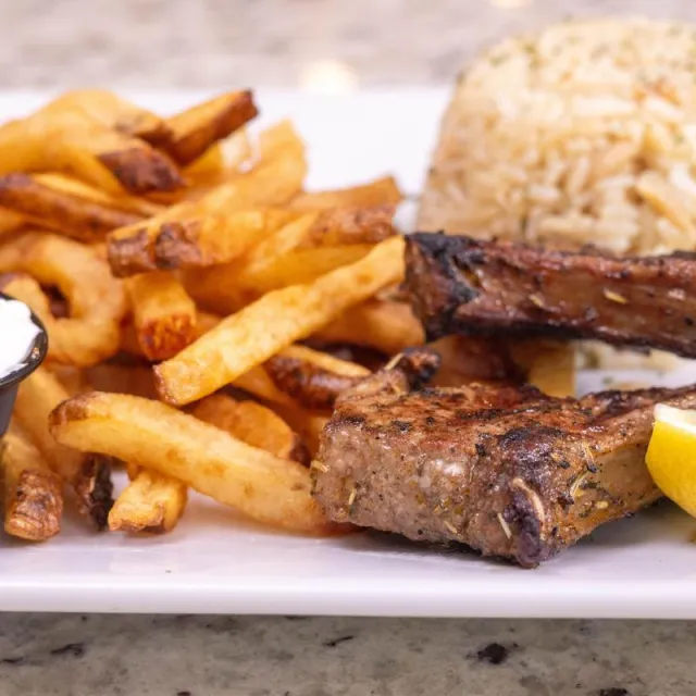 Lollipop lamb chops over hand-cut fries