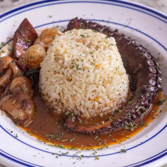 Octopus stifado over rice pilaf